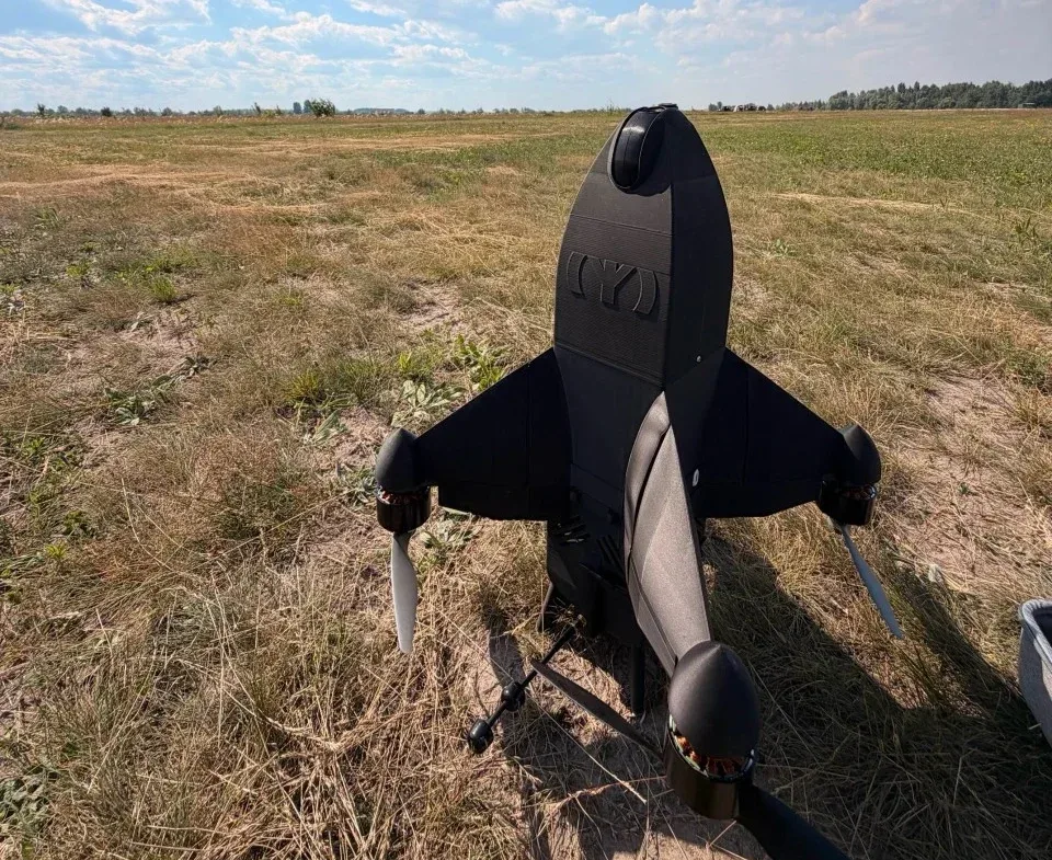 Algiz-1 interceptor drone standing on its tail in a grassy field
