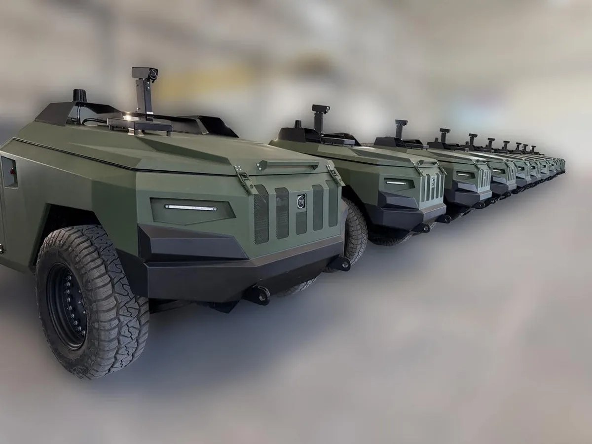 Row of olive-green Protector four-wheel unmanned ground vehicles