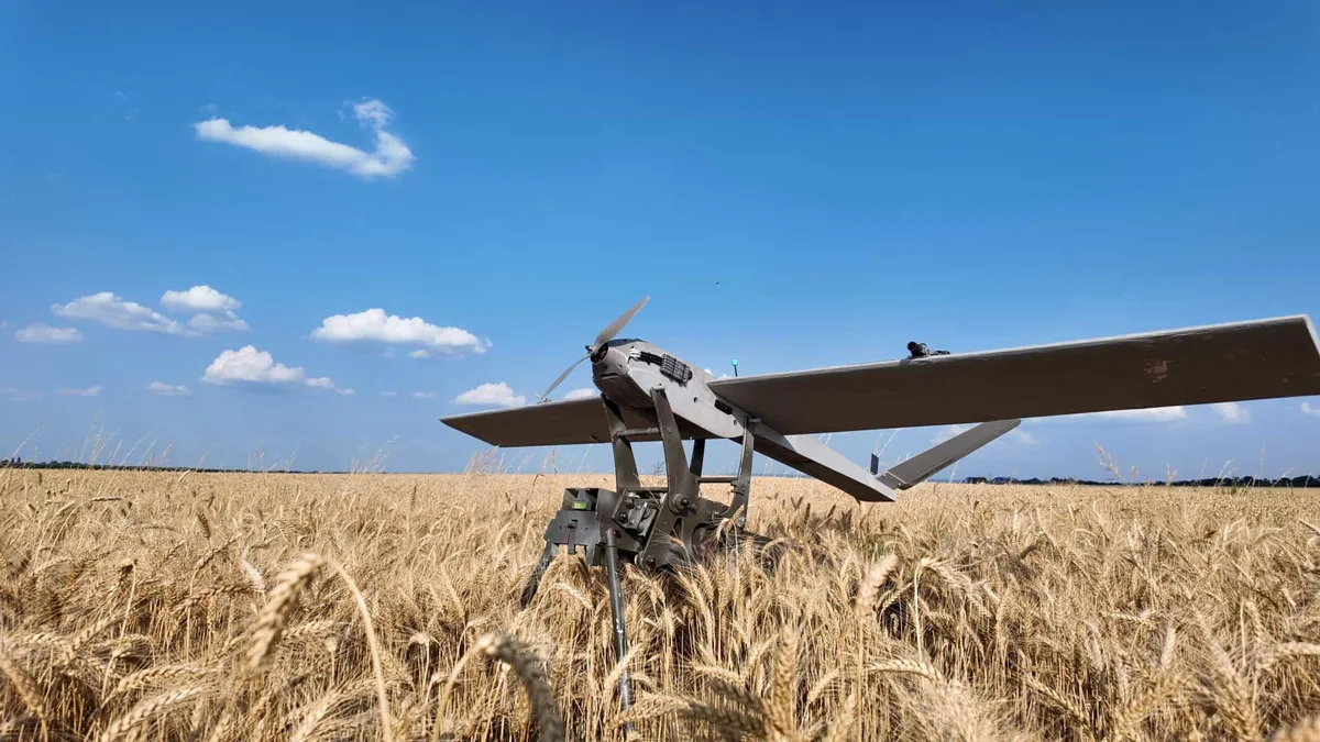 SAKER Hunter fixed-wing drone in a wheat field